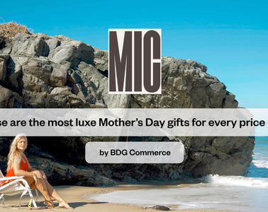 Woman sitting on a Shore Thing Chair at the beach by the cliffs